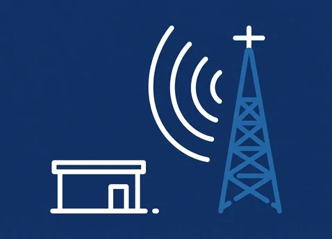 Icon of a transmission mast sending signal arcs to a dish on the roof of a commercial building, representing fixed wireless and cellular internet